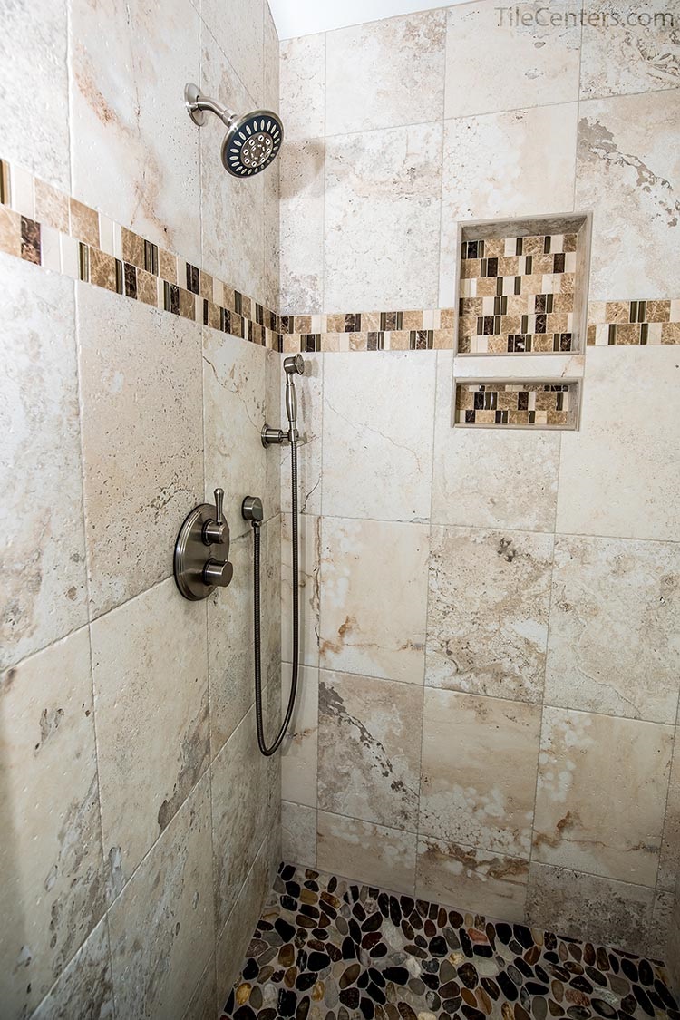 Beige Tile Shower with Stone Floor and Brushed Nickel Faucets