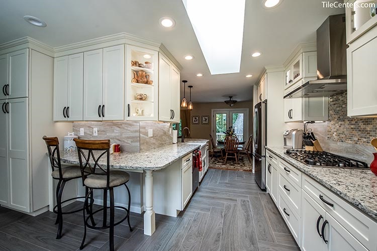 White Kitchen Cabinets with Wood look tile floors