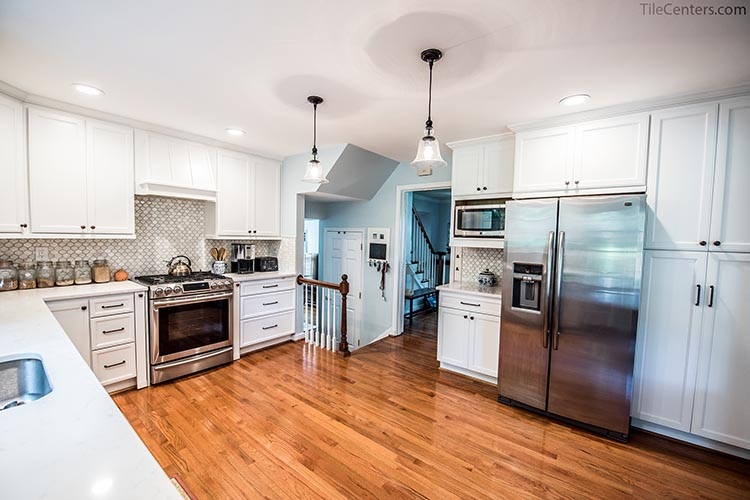 White kitchen with hardwood floors